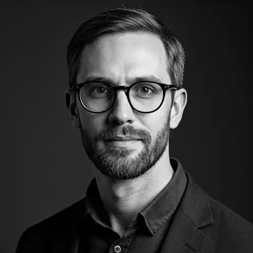 High contrast black and white portrait of agency founder